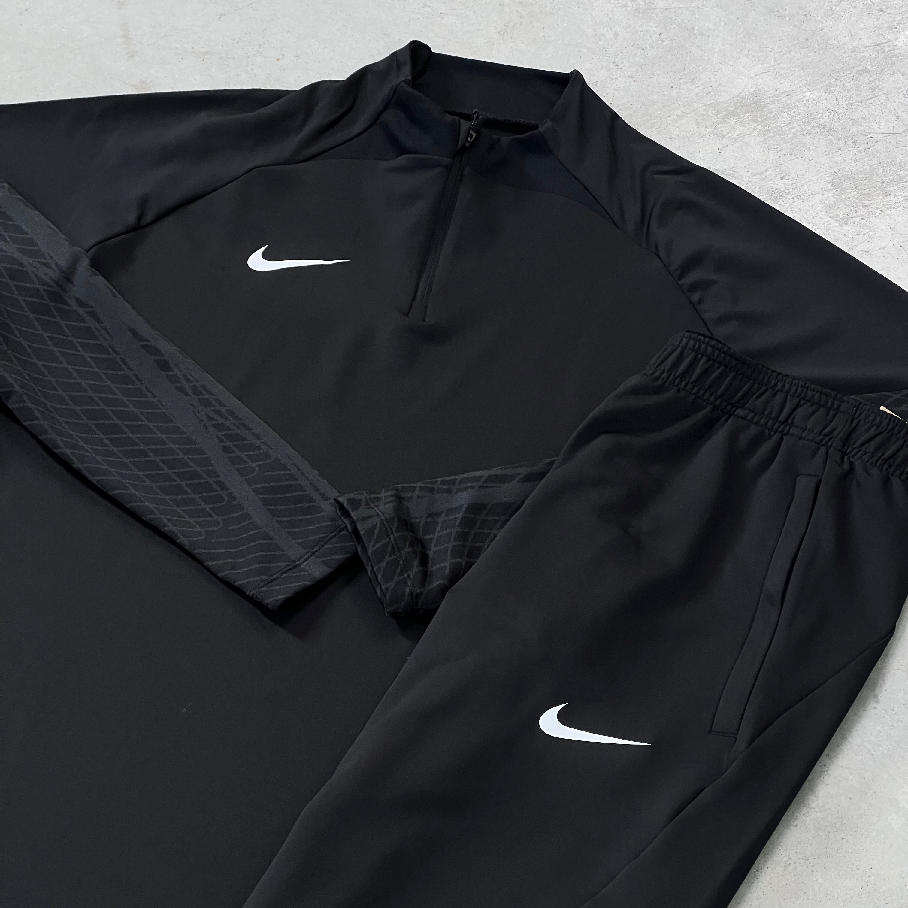 nike black half zip tracksuit
